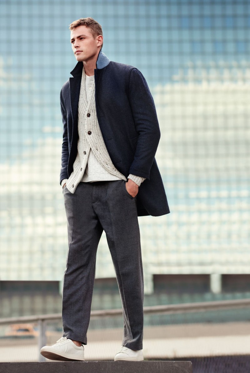Tom Barker models a double-face topcoat from Club Monaco.