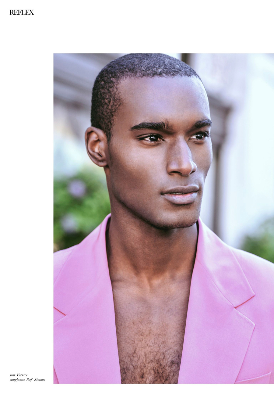 Corey Baptiste Models Colorful Styles for Reflex Homme Cover Shoot