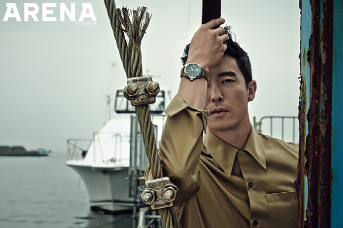 Daniel Henney poses for a close-up in a khaki shirt.