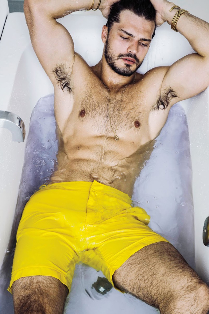 Diego wears swim shorts Orlebar Brown.