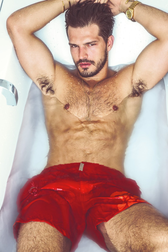 Diego wears swim shorts Vilebrequin.