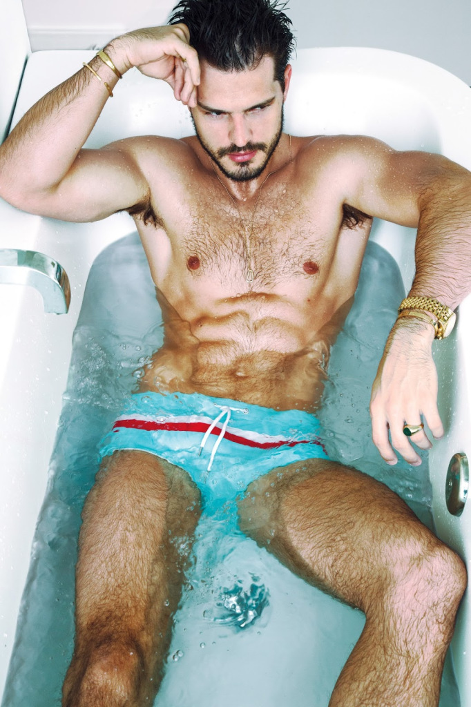 Diego wears swim shorts Parke & Ronen.