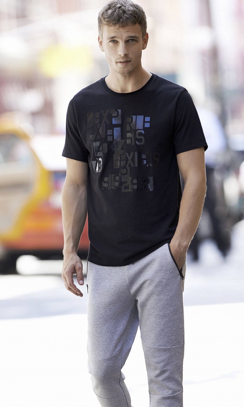 Benjamin Eidem sports an Express graphic t-shirt with joggers.