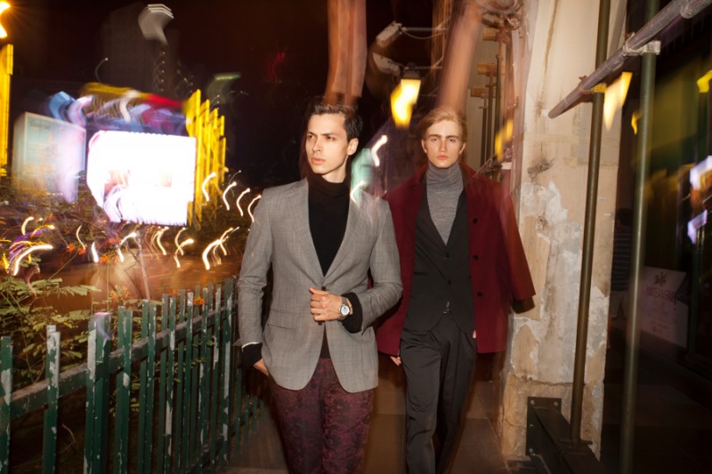 Left to Right: Roman wears blazer Boglioli, turtleneck Ami and pants Deboneire. Dylan wears jacket Paul Smith London, turtleneck H&M, suit and belt Hugo Boss.