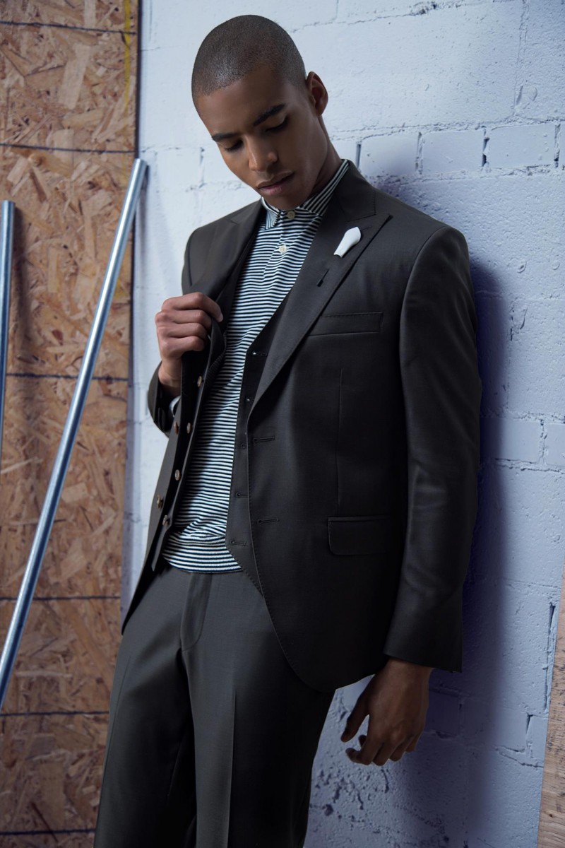 Malik wears suit Gian-Paolo Mazzotta, polo shirt and pin Club Monaco.