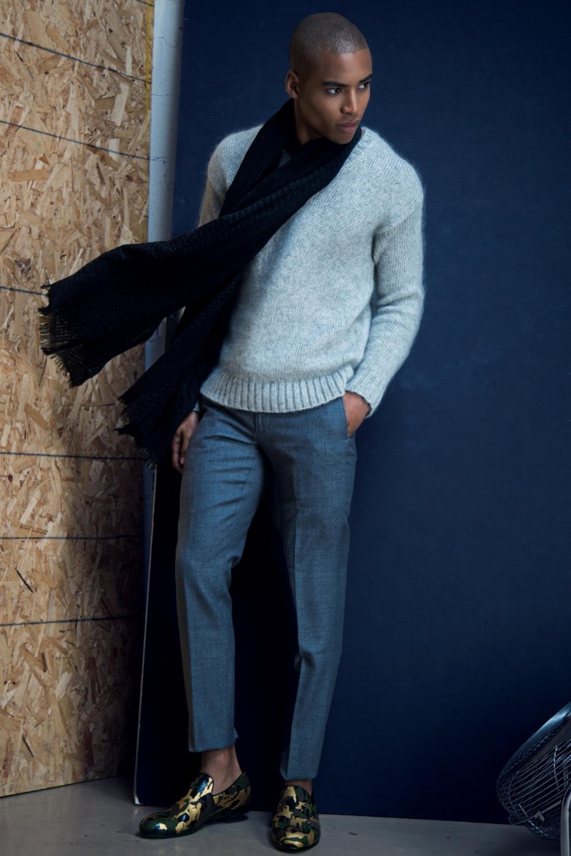 Malik wears sweater AMI by Alexandre Mattiussi, pants J.Crew, scarf Club Monaco and shoes Jimmy Choo.