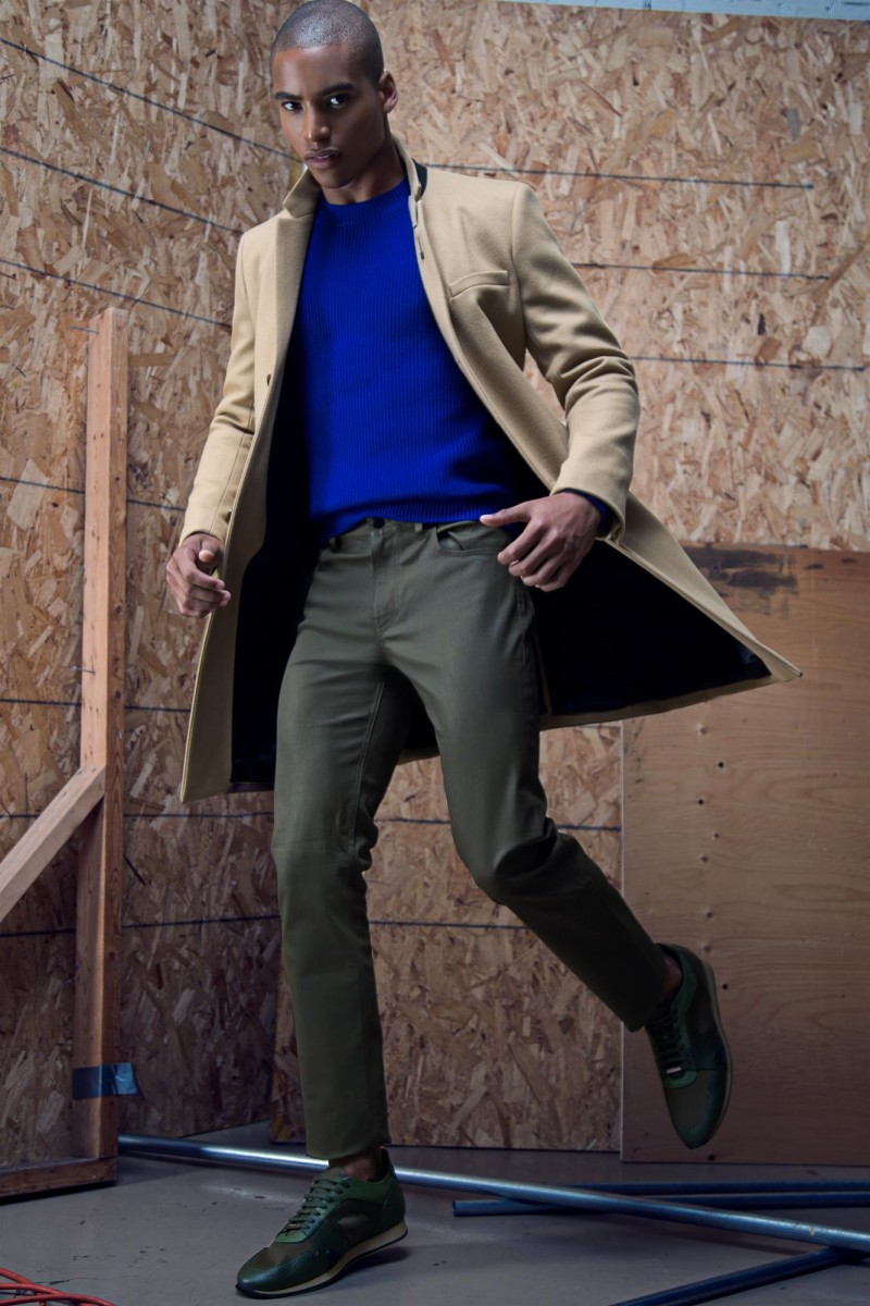 Malik wears shoes Burberry Prorsum, jacket and sweater Sandor, pants and pin Club Monaco.