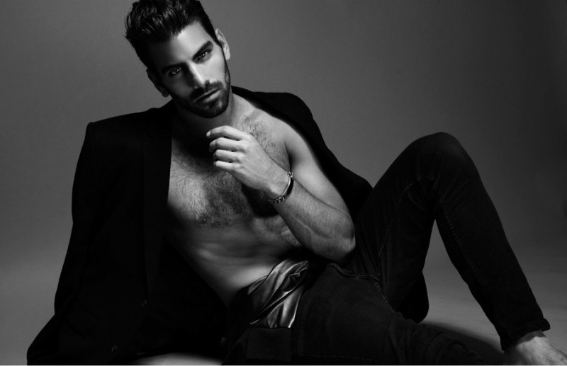 Nyle wears blazer AllSaints, jacket around waist Calvin Klein, jeans Rag & Bone and bracelet ASOS.