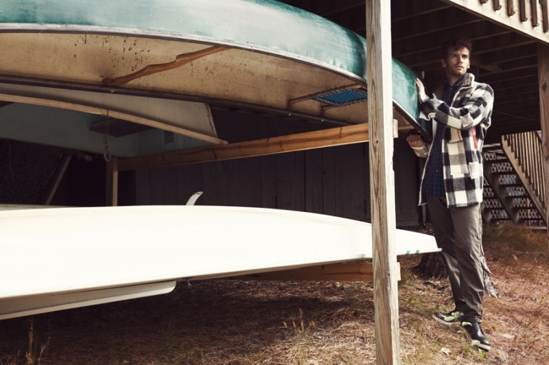 Sean wears buffalo check coat Off-White, boots Bally, cargo pants and plaid button-down A.P.C.