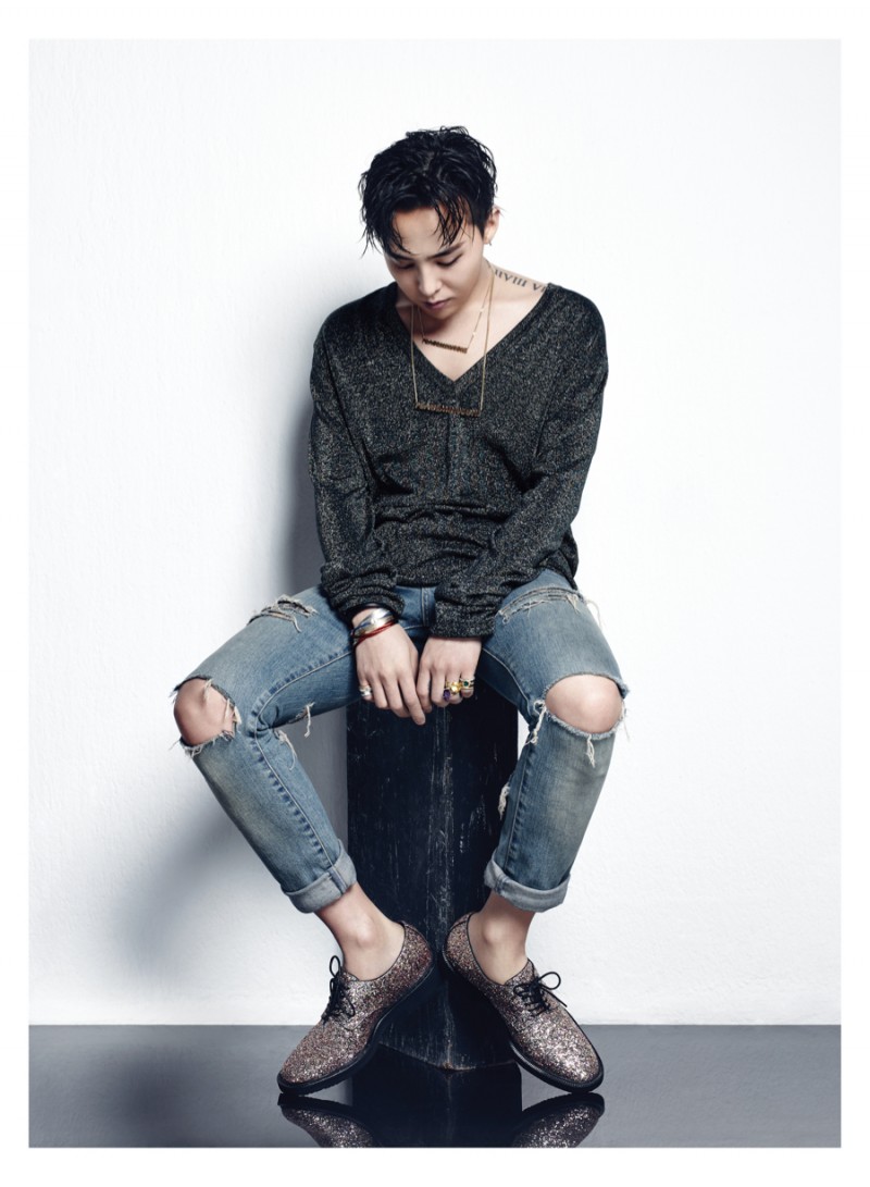 Sporting trendy ripped denim jeans, G-Dragon mixes casual and formal elements, showcasing his Giuseppe Zanotti dress shoes.