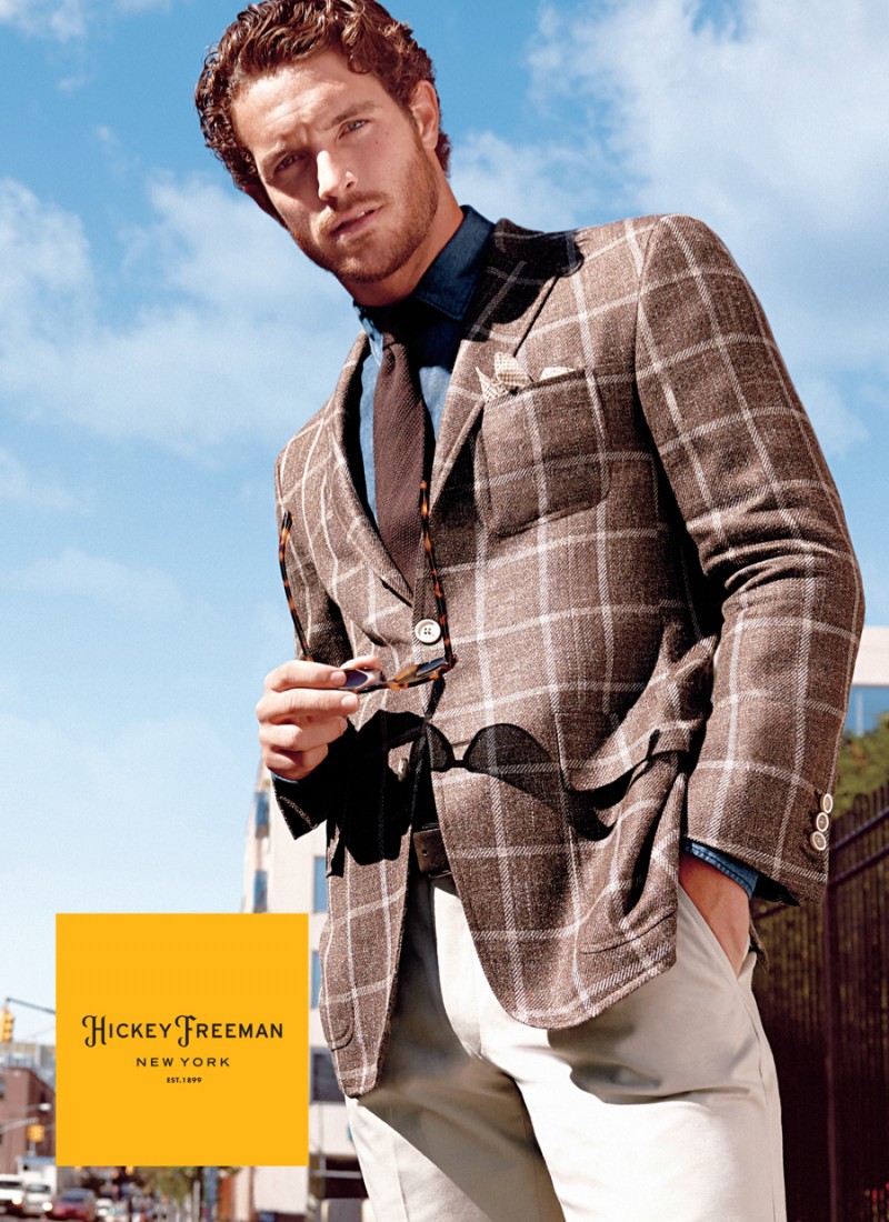 Donning a windowpane print, Justice Joslin is photographed by Yu Tsai for Hickey Freeman's fall-winter 2015 campaign.