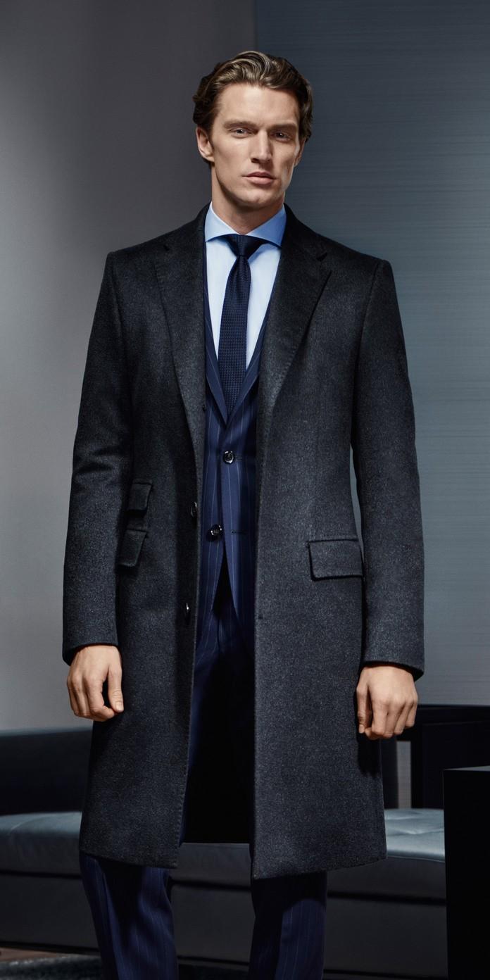 Photographed by Henrik Bulow, South African model Shaun DeWet stars in Hugo Boss' Made to Measure campaign for fall-winter 2015. Shaun cuts a sharp shape as he hits the studio, posing for striking portraits in suiting and fine outerwear.