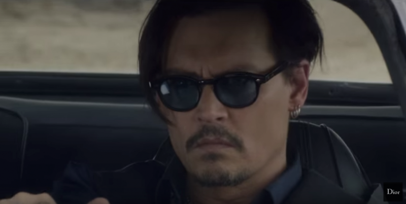Johnny Depp goes for a spin through the desert in his cool Dior sunglasses.