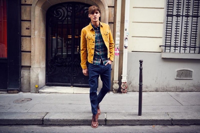 Isaac Carew adds a pop of color to his wardrobe with a lightweight jacket.