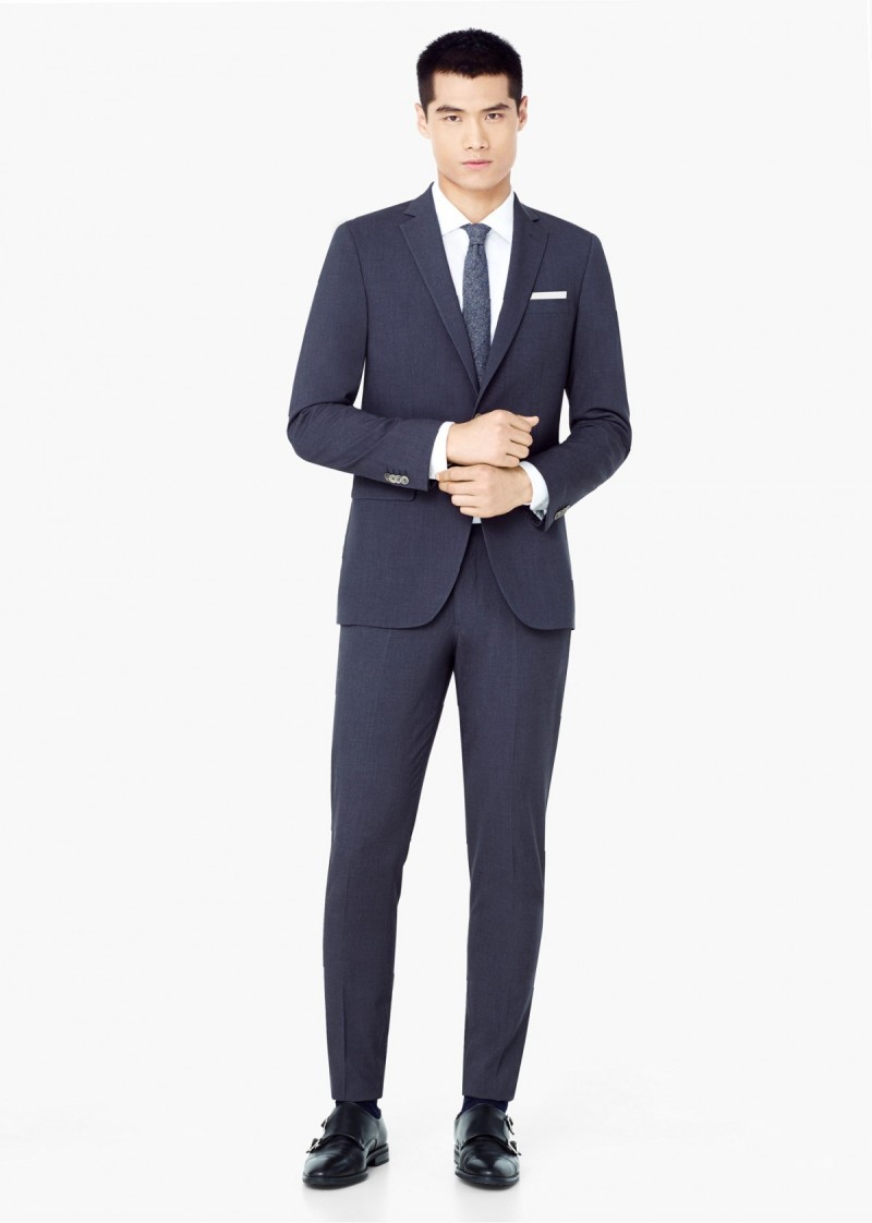 Men's Slim-Fit Suiting: Model Hao Yun Xiang wears Mango's Basilia suit. "The Basilia model features a jacket with standard lapels, narrow shoulders and slanted flap pockets, as well as a ticket pocket. The trouser is slightly tapered, which gives you a modern look without sacrificing comfort."