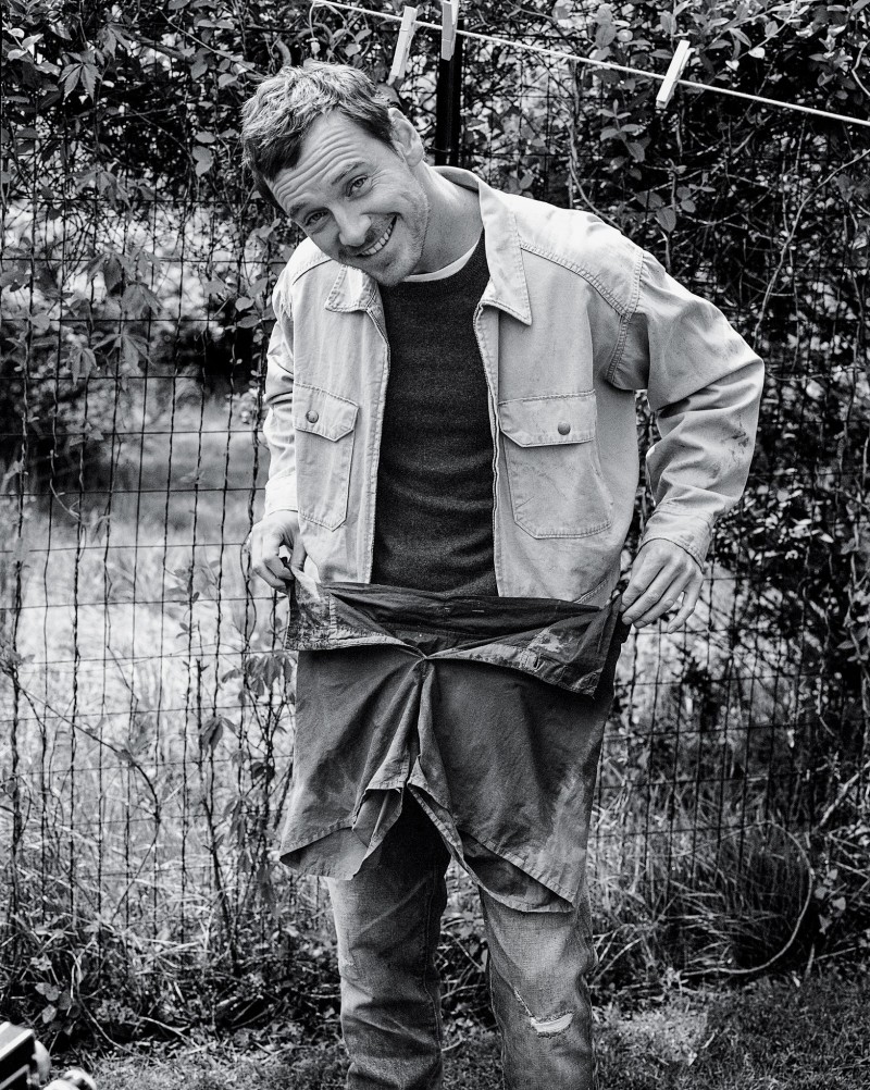 Michael Fassbender is all smiles as he connects with photographer Bruce Weber for the photo shoot.