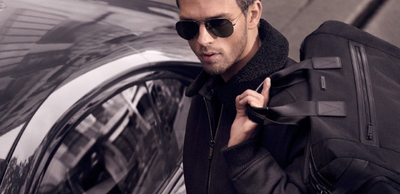 The face of Michael Kors' fall-winter 2015 campaign, Swedish model Benjamin Eidem reunites with the American brand for its latest catalogue. Encompassing the image of the international jetsetter once more, Benjamin is front and center in classic, sleek looks. Pictured ready to hit the road, Benjamin showcases choice bags, timepieces and aviator sunglasses from Michael Kors.