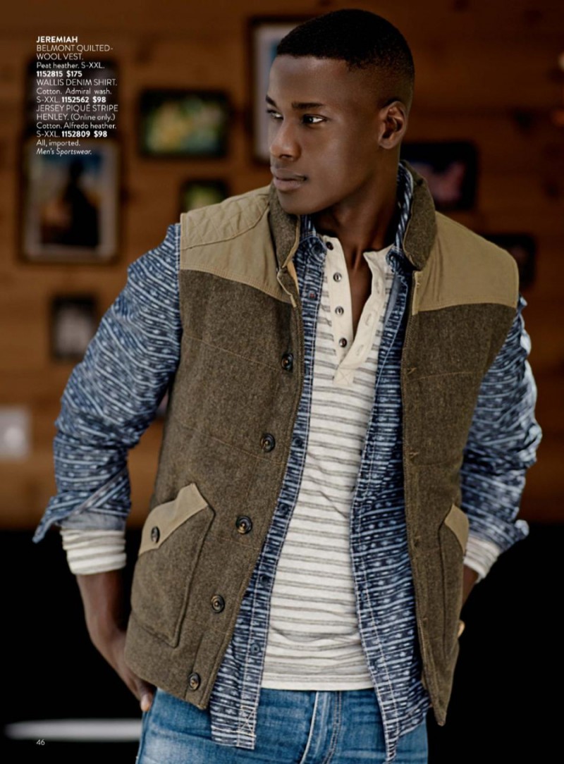 David Agbodji embraces rugged style in a vest, layered with a printed shirt and henley.