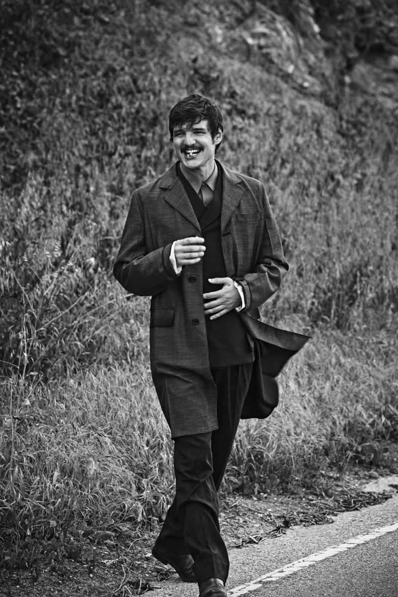 Pedro Pascal is all smiles as he heads outdoors for a black & white photo shoot.