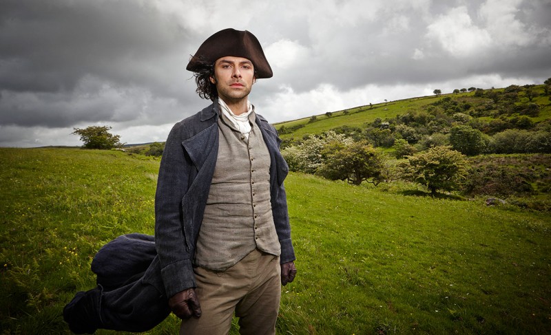 Pictured outdoors, Ross Poldark (Aidan Turner)  dons separates, layering with an overcoat and waist.