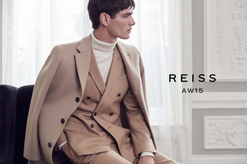 Julien Sabaud showcases camel hues in an overcoat with a double-breasted suit.