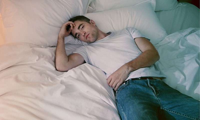Robert Pattinson poses for a pictured in bed with the Observer.