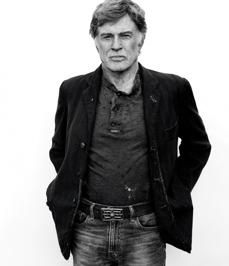 Robert Redford rocks a sports jacket over a henley and denim jeans.