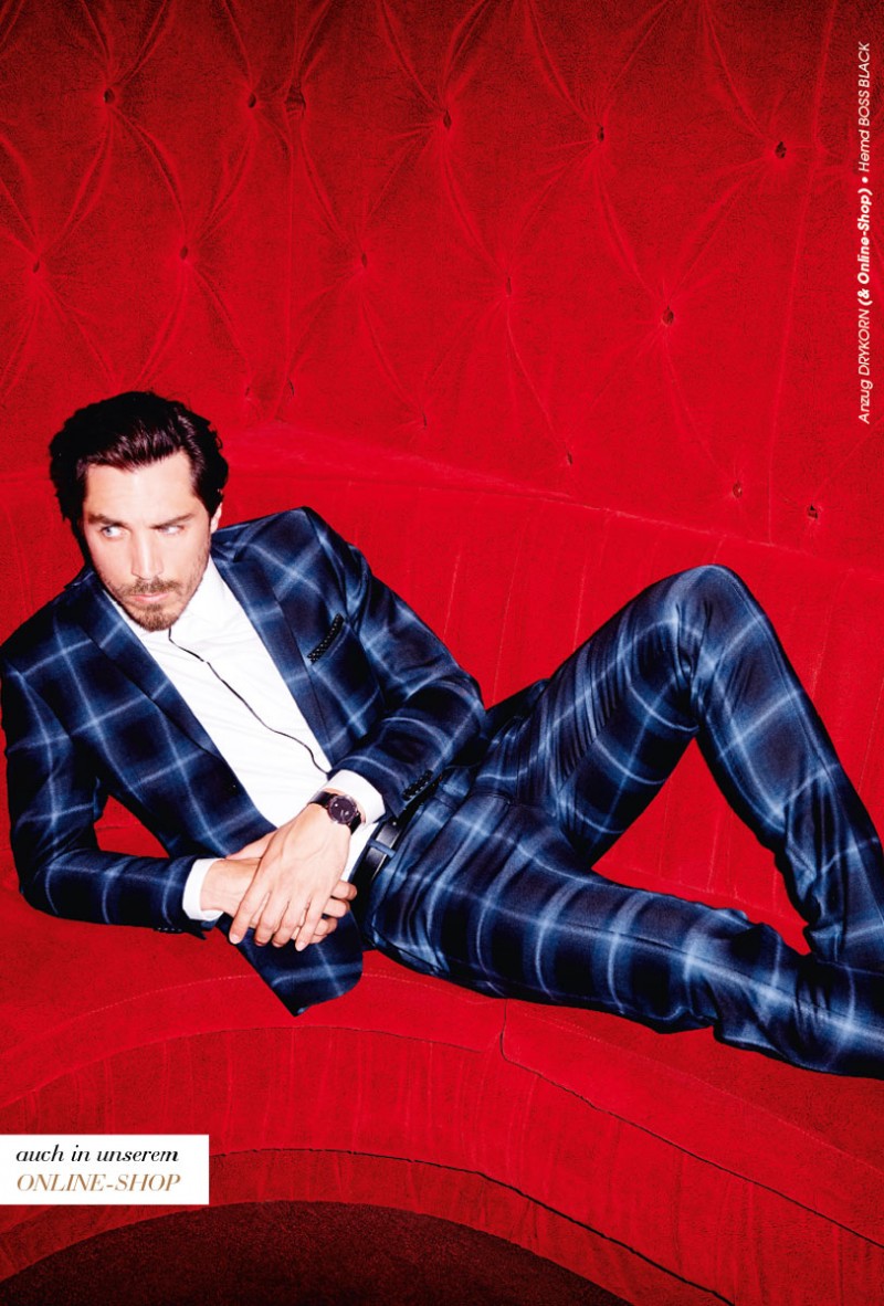 Guillaume Mace rocks a stylish plaid suit.