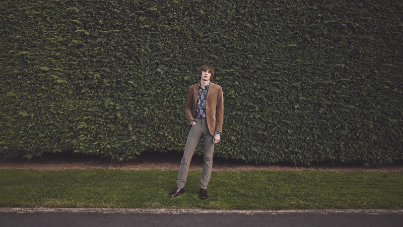 Oscar Robertson wears corduroy blazer Polo Ralph Lauren, printed cotton shirt Alexander McQueen, slim-fit cotton corduroy trousers Tomas Maier and leather chelsea boots R.M. Williams.