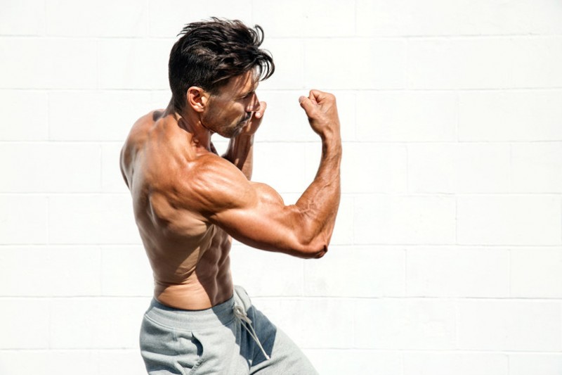 Frank Grillo hits a strong fighting pose.