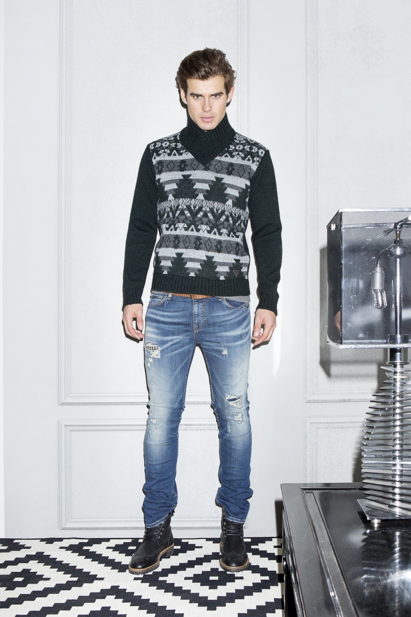 Matt Trethe rocks a GUESS printed sweater with distressed denim jeans.