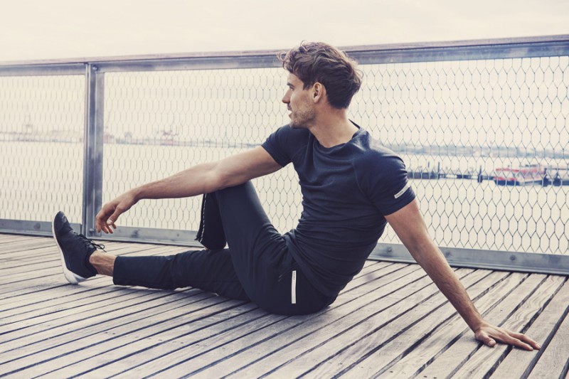 Arthur Kulkov stretches in ISAORA's latest activewear.