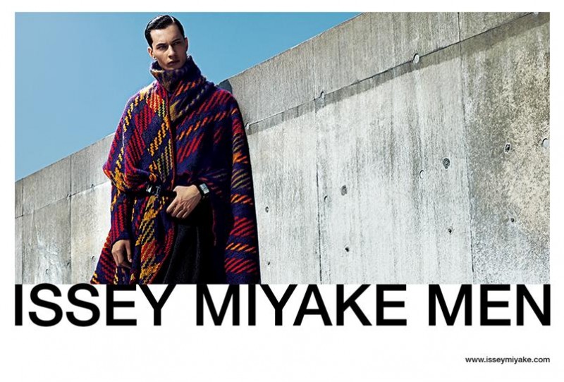 Model Dima Dionesov makes quite the printed impression as he stars in Issey Miyake's fall-winter 2015 campaign. The Sight Management model is front and center in a graphic update on tartan.