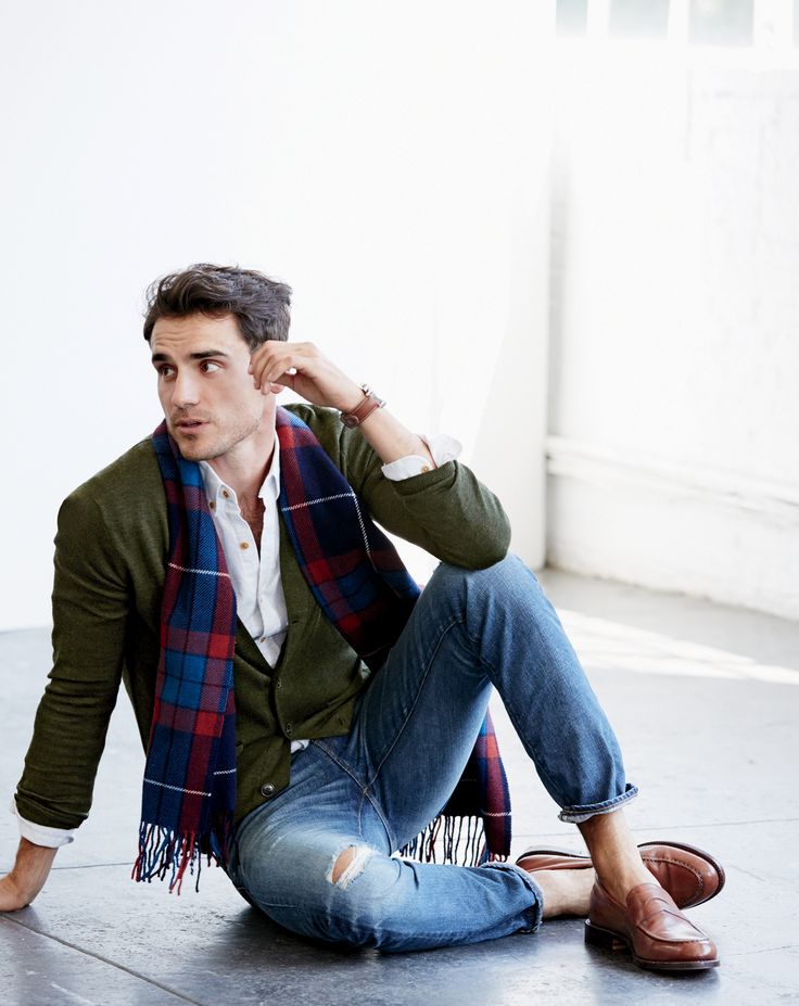 Arthur Kulkov poses in J.Crew's slim merino wool cardigan.