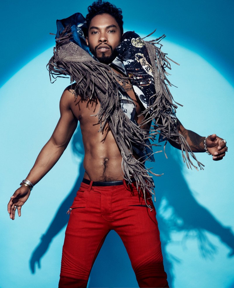 Miguel goes shirtless in red Balmain pants.