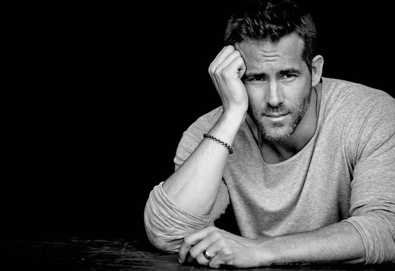 Ryan Reynolds sits for new photos by photographer Matthew Brookes. Appearing in InStyle, Reynolds goes casual in a t-shirt, sweater and distressed denim jeans.