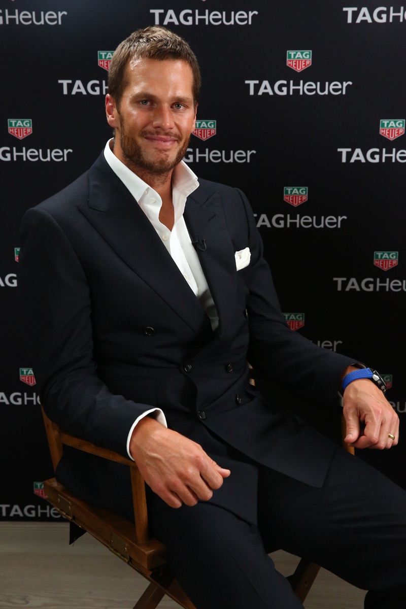Tom Brady cleans up in a double-breasted navy suit.