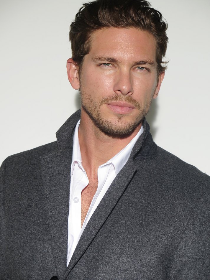 Donning a gray coat, American model and actor Adam Senn stops by his London agency Select for new pictures.