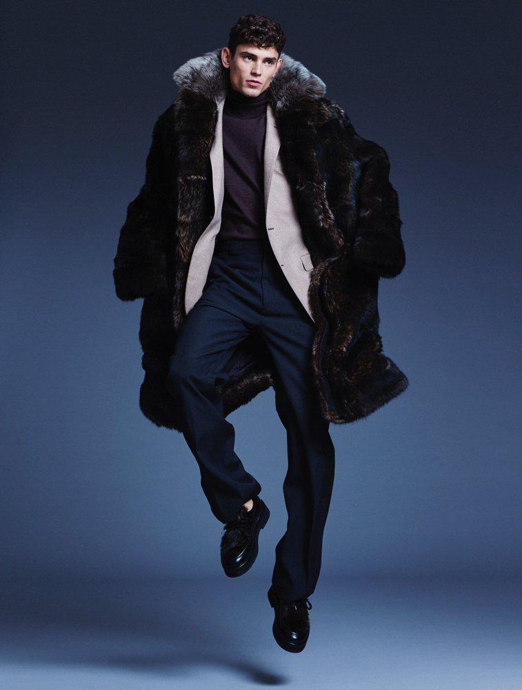 Arthur shows a luxurious edge in an oversized fur coat.