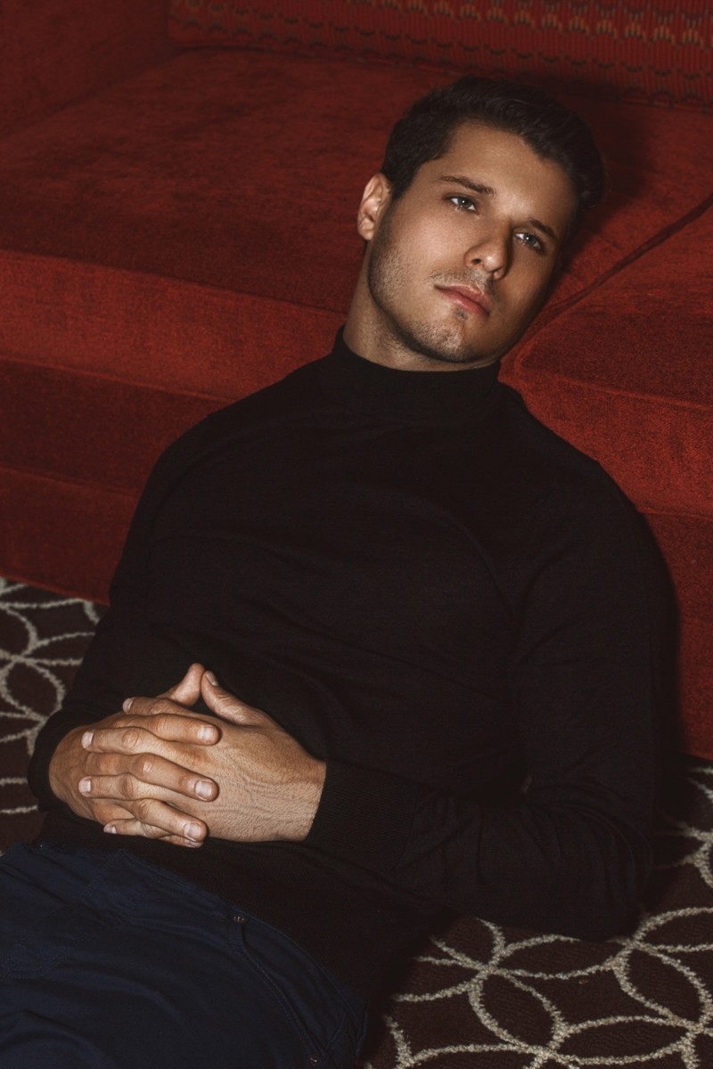 Cody Calafiore wears turtleneck sweater Calvin Klein.