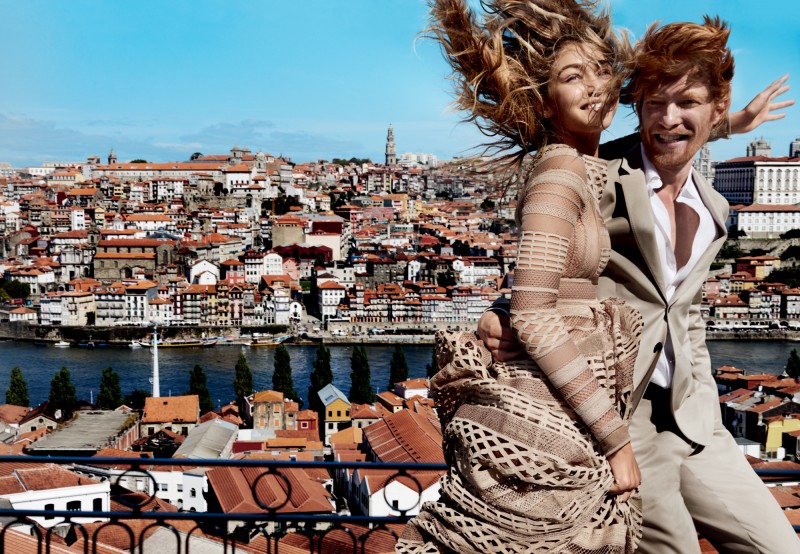 Wearing a Burberry London suit with a Hermes shirt, Domhnall Gleeson is all smiles as he joins Gigi Hadid.