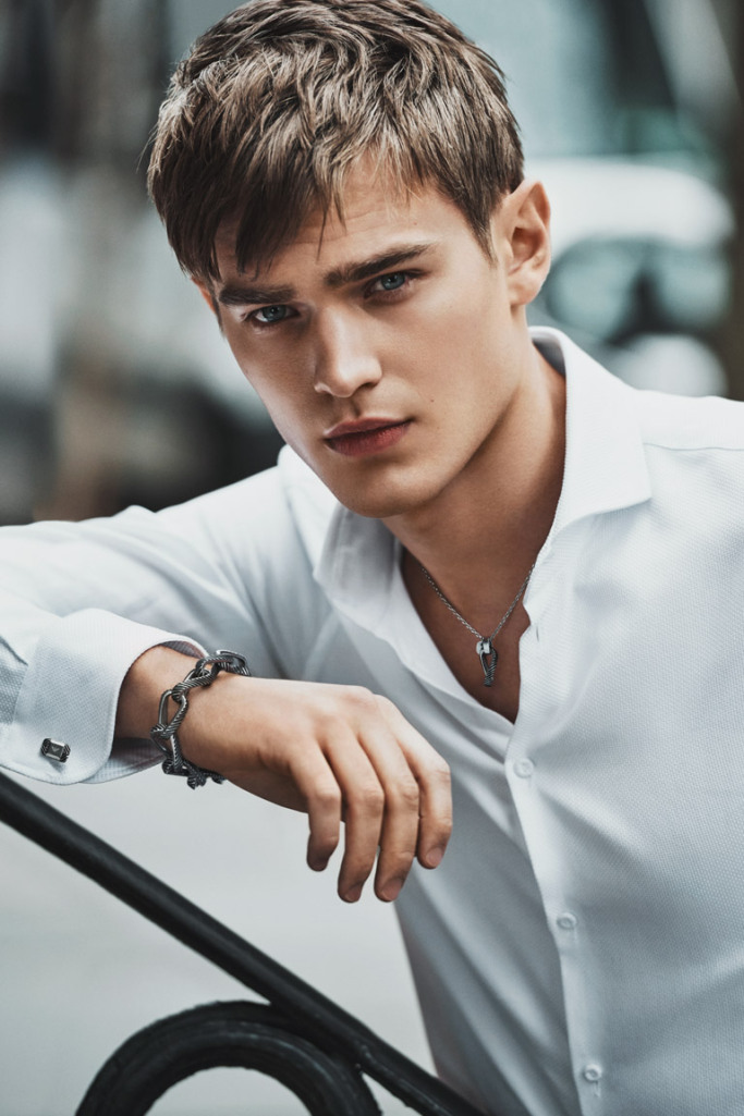 Photographed by Lachlan Bailey, model Bo Develius fronts Emporio Armani's fall-winter 2015 jewelry campaign. The Swedish model is photographed outdoors as he dons a crisp white dress shirt, accessorized with a bracelet and necklace.