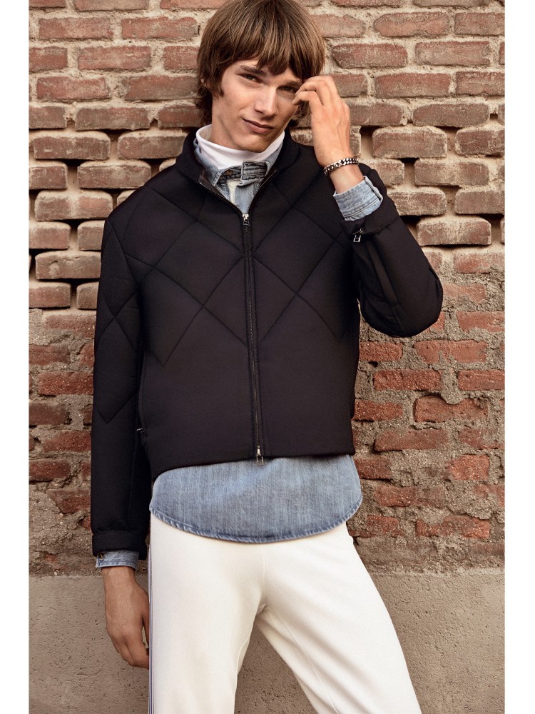 Erik is a modern vision in a cropped sporty jacket.