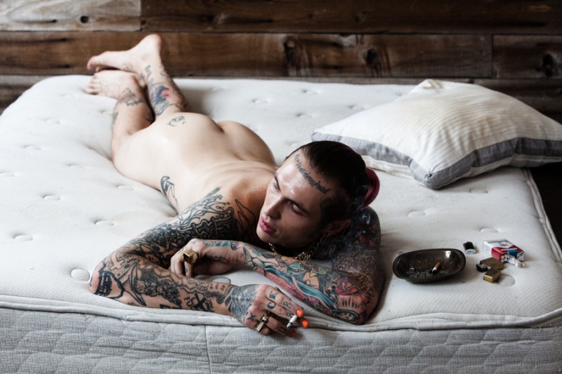 Going nude, Bradley Soileau enjoys a smoke in bed.