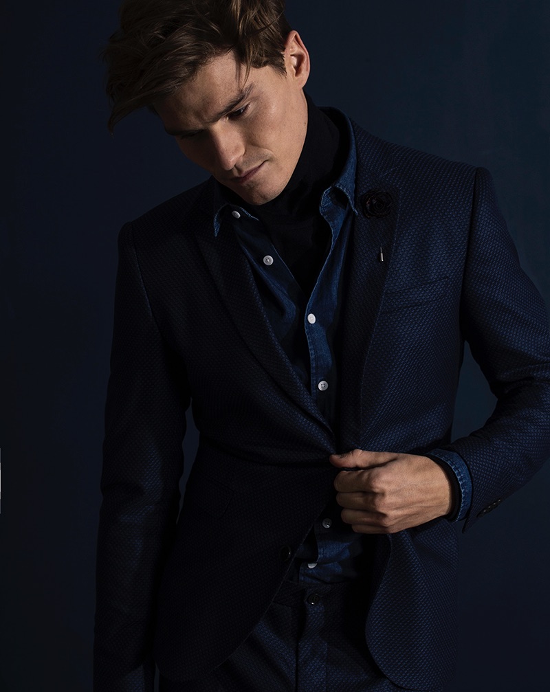 Oliver wears turtleneck GANT, denim shirt J.Lindeberg, suit Jack & Jones Premium and pin River Island.