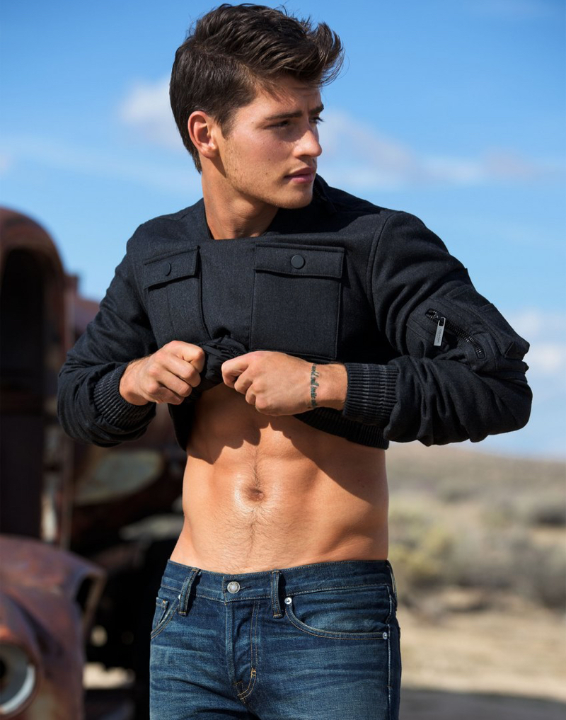 Gregg Sulkin sports a Calvin Klein top with Tom Ford jeans.