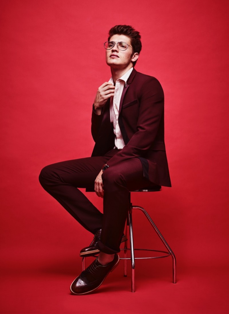 Gregg Sulkin wears suit Suit Prada, dress shirt Calvin Klein, shoes Burberry and watch FLÜD Watches.