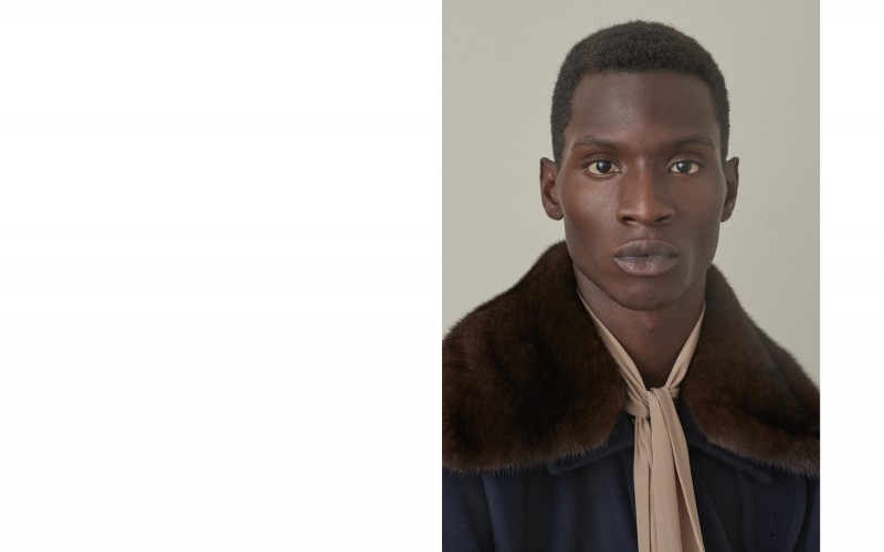 Adonis poses for a portrait in a Gucci cape.
