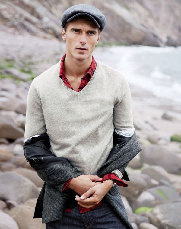 Clément wears J.Crew men’s cotton-cashmere V-neck sweater, midweight flannel shirt in holiday red plaid, driving cap and Ludlow blazer in windowpane.