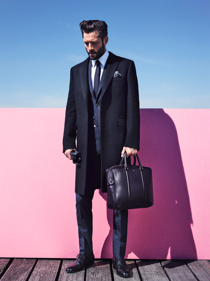 John cleans up in a sleek tailored coat and suit for GQ France's Style Manuel.